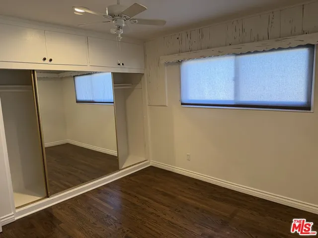 a view of a storage & utility room with wooden floor