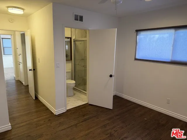 a view of an entryway with wooden floor