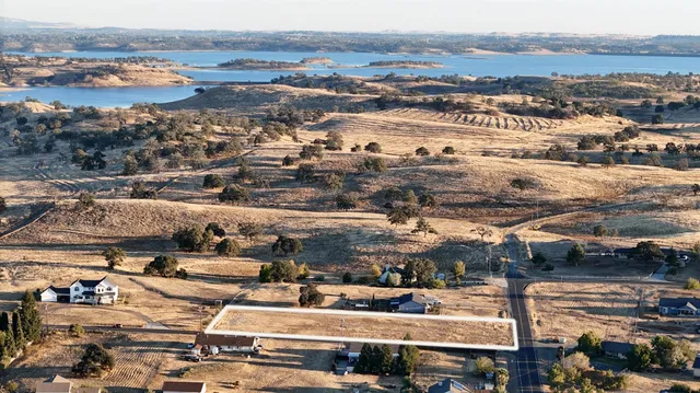 an aerial view of residential houses and outdoor space