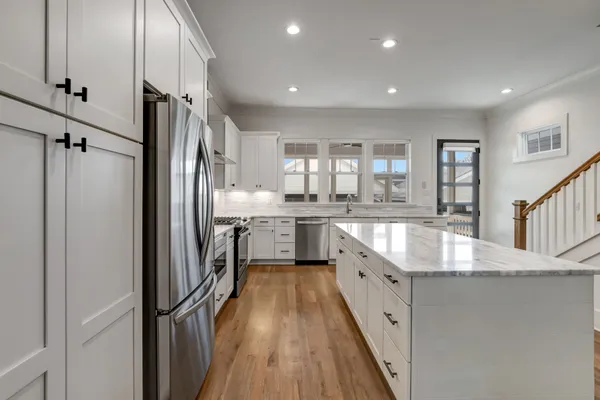 a kitchen with sink and cabinets