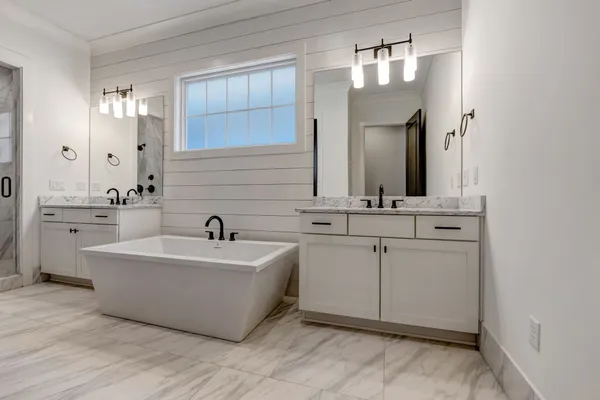 a white bath tub sitting in a bathroom