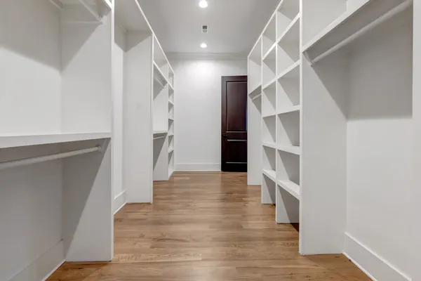 a view of gallery with wooden floor