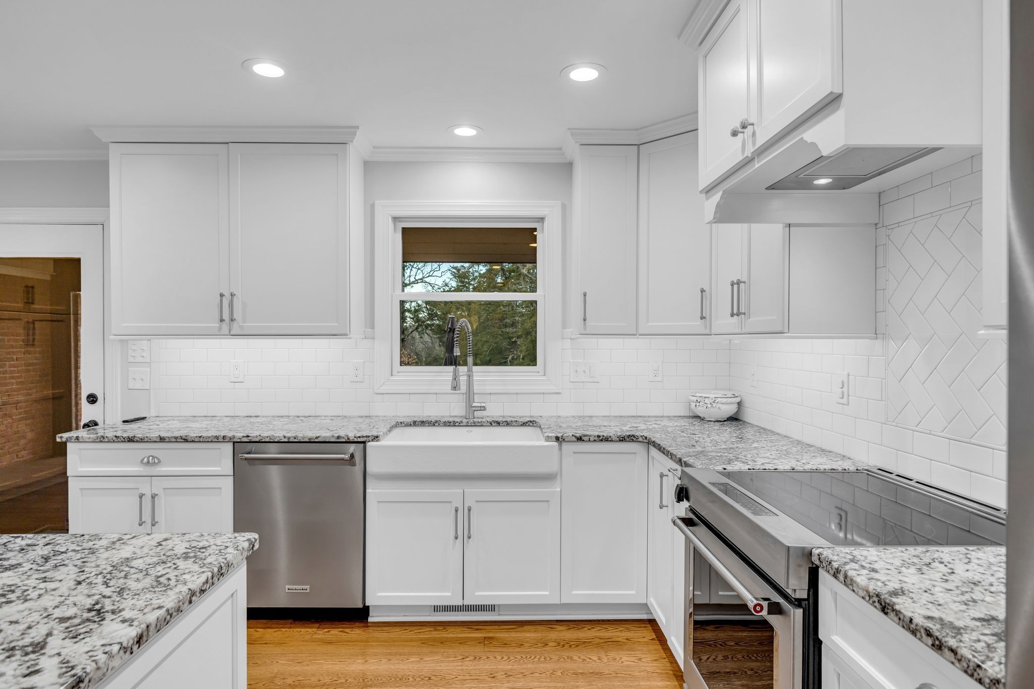 2058 Kidd Road Nolensville, TN 37135 - Photo 15 of 63 a kitchen with a sink stove and cabinets