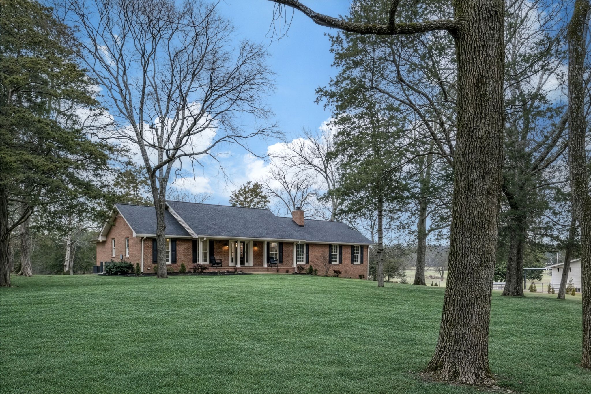 2058 Kidd Road Nolensville, TN 37135 - Photo 4 of 63 a front view of a house with garden
