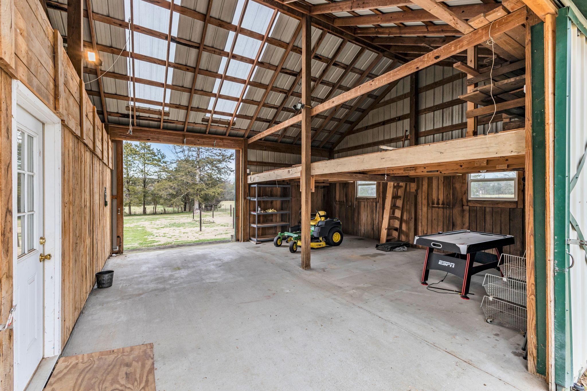 2058 Kidd Road Nolensville, TN 37135 - Photo 46 of 63 a view of a room with gym equipment and floor to ceiling window