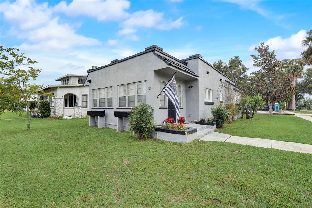189 Guerrant Street Umatilla, FL 32784 - Photo 1 of 1 a view of a house with backyard and porch