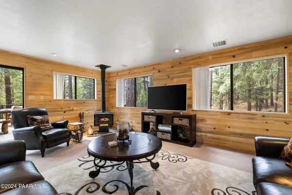 a kitchen with stainless steel appliances granite countertop a stove refrigerator sink and microwave