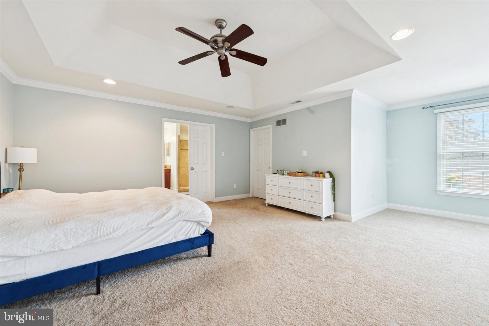 103 Palsgrove Way Chester Springs, PA 19425 - Photo 19 of 35 a bedroom with a large bed chandelier and a window