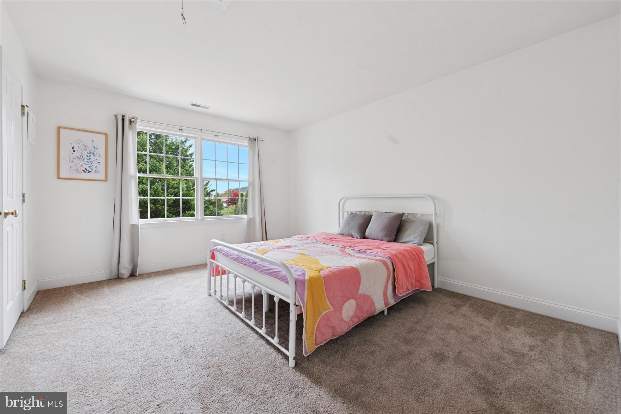 103 Palsgrove Way Chester Springs, PA 19425 - Photo 23 of 35 a bedroom with a bed lamp and window