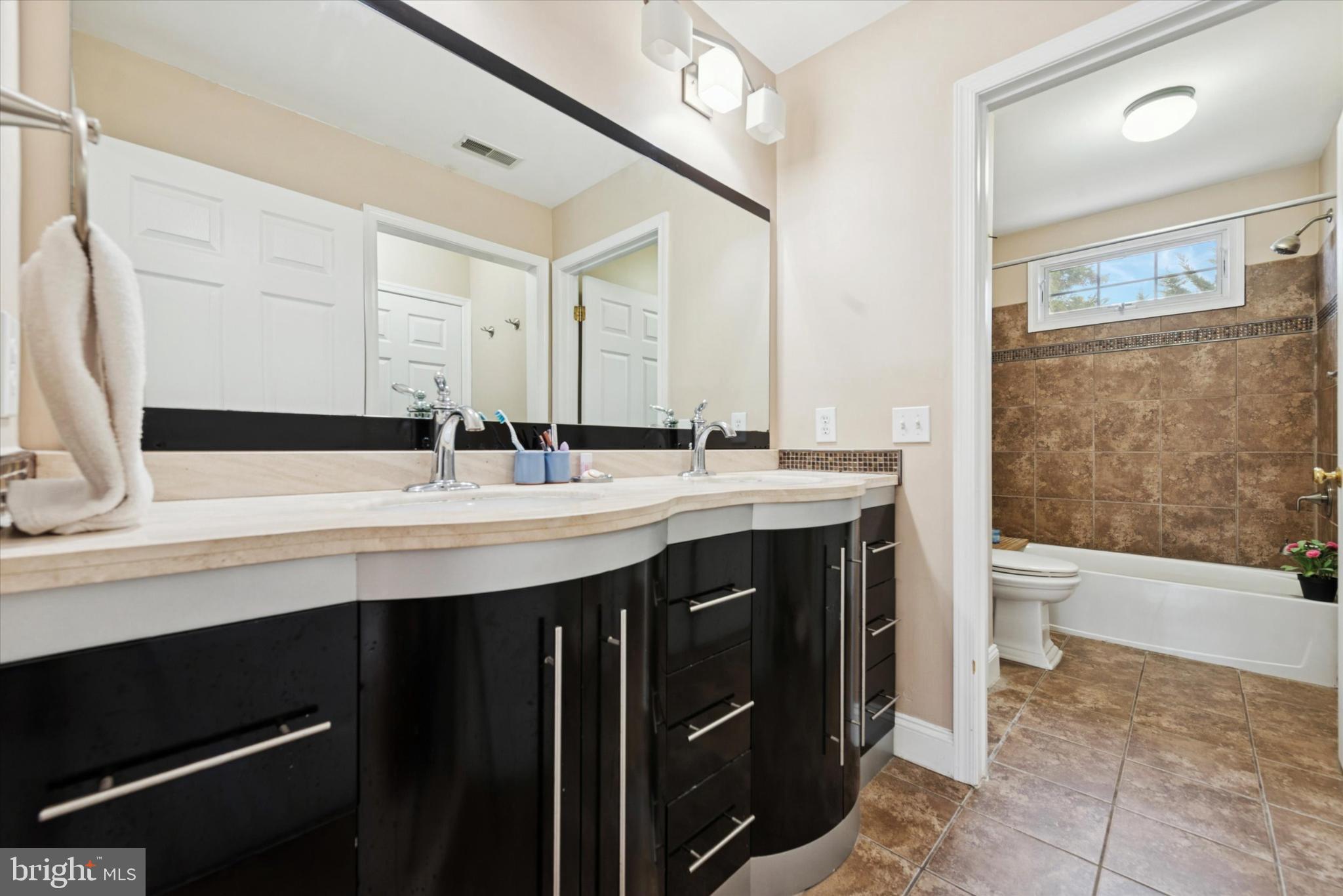 103 Palsgrove Way Chester Springs, PA 19425 - Photo 26 of 35 a bathroom with a double vanity sink a toilet and a tub