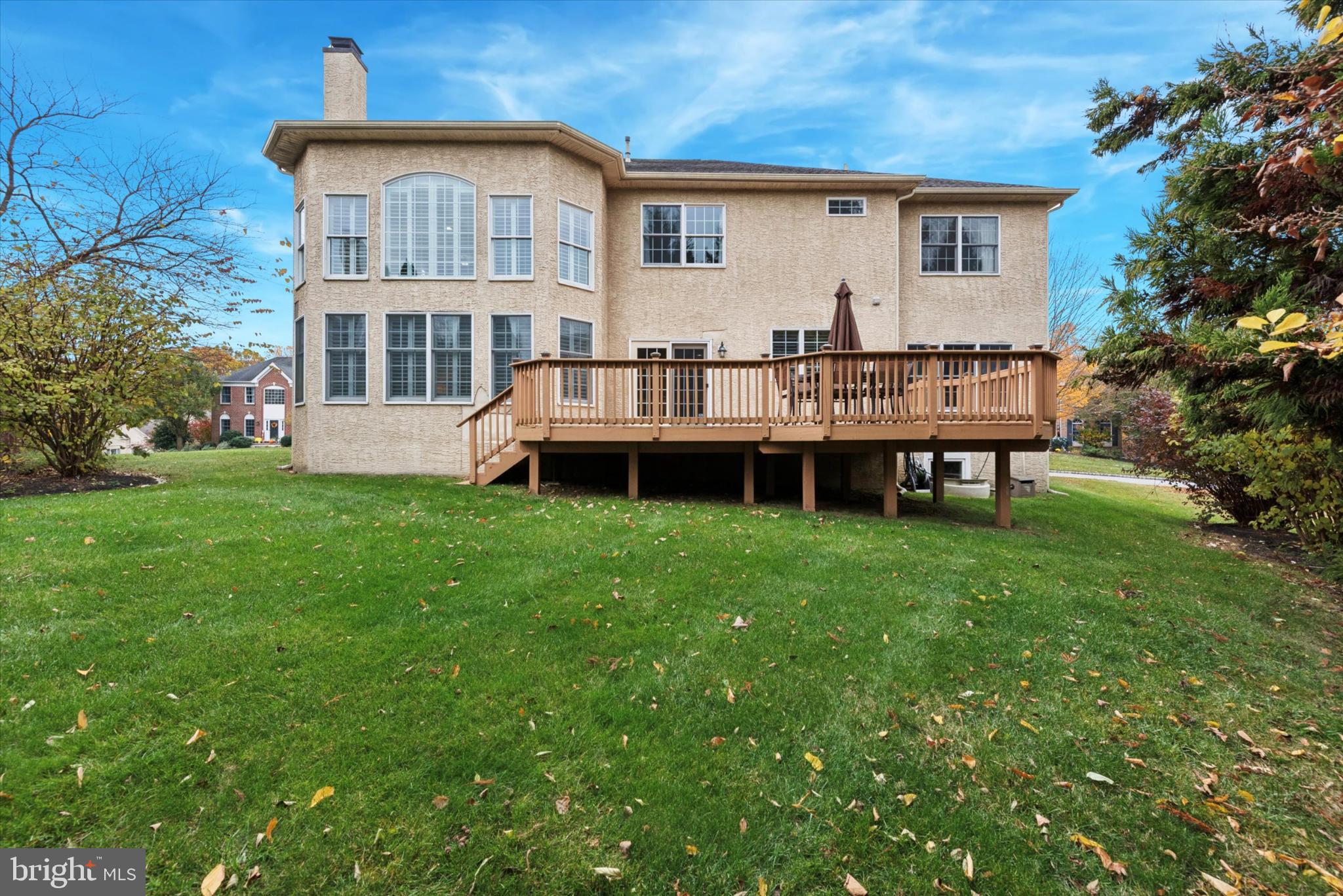 103 Palsgrove Way Chester Springs, PA 19425 - Photo 32 of 35 a front view of a house with a garden and deck