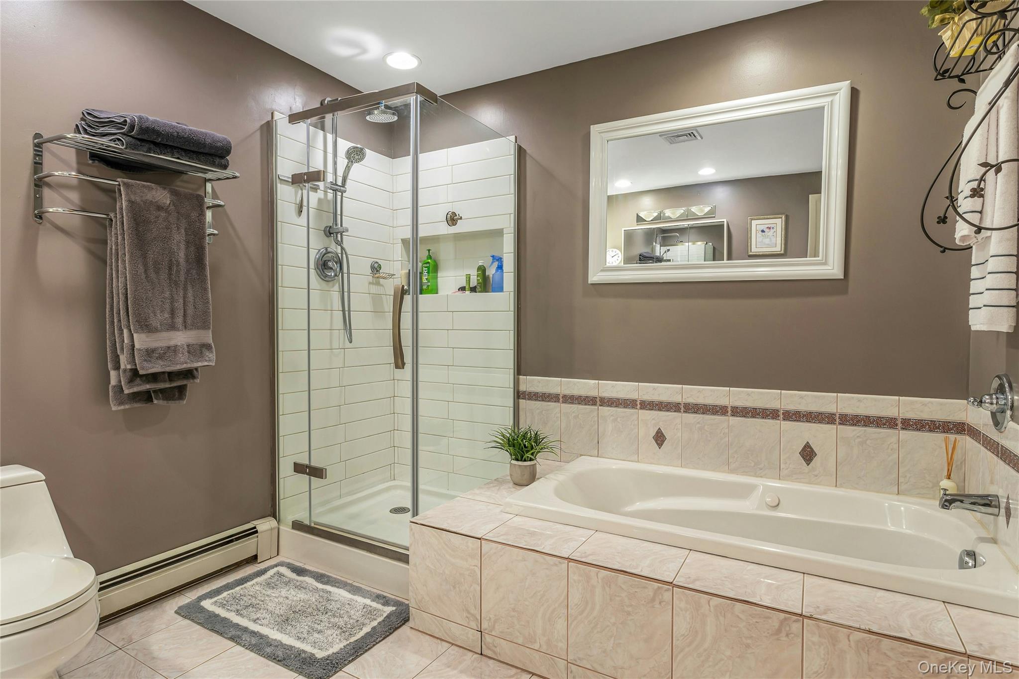 204 Cherry Hill Road Carmel, NY 10512 - Photo 17 of 36 a bathroom with a tub a sink and glass door