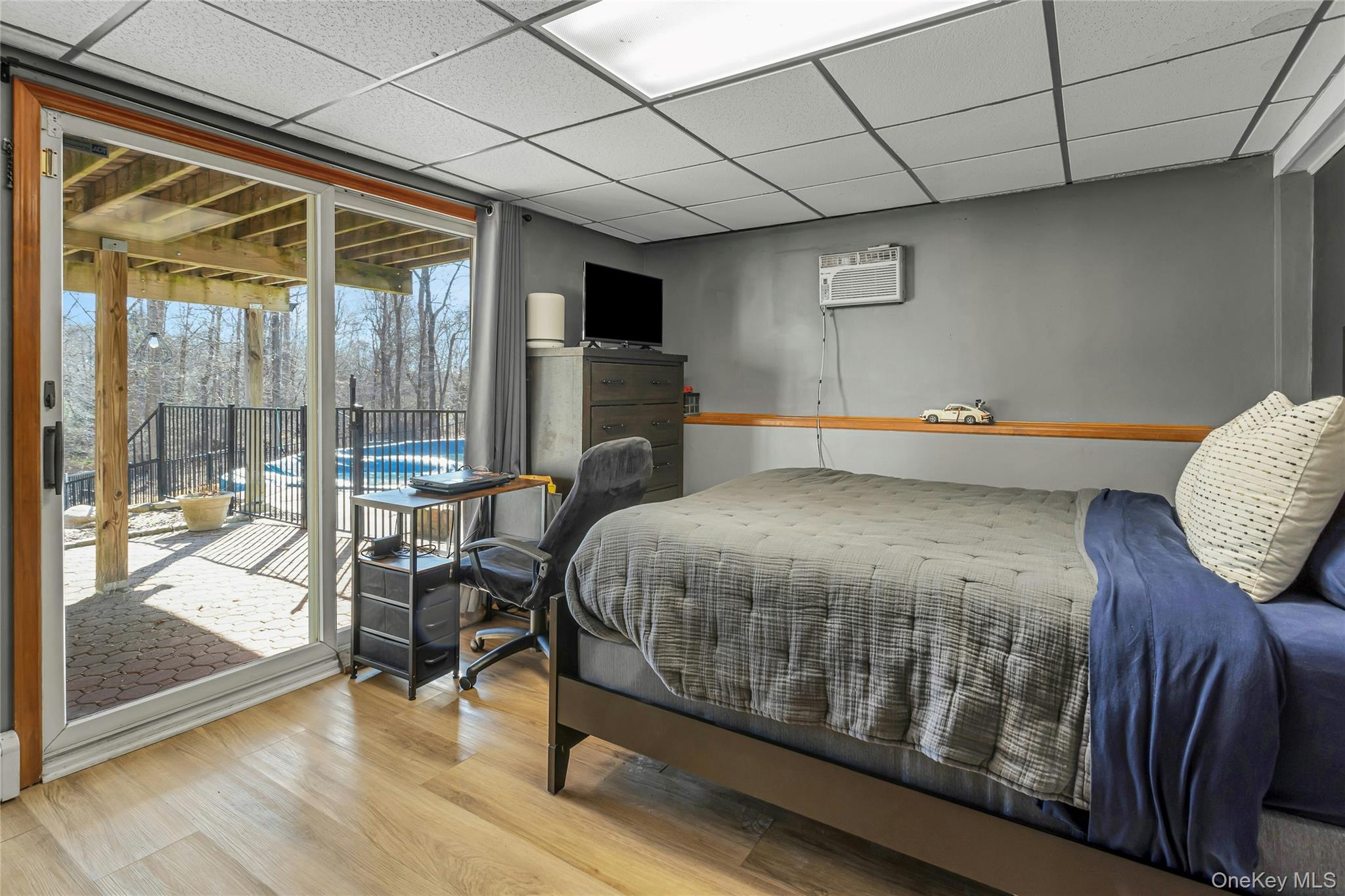 204 Cherry Hill Road Carmel, NY 10512 - Photo 19 of 36 a bedroom with a bed and wooden floor