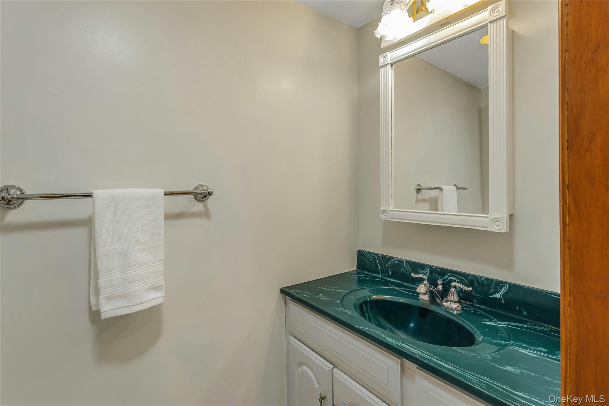 204 Cherry Hill Road Carmel, NY 10512 - Photo 27 of 36 a bathroom with a granite countertop sink and a mirror