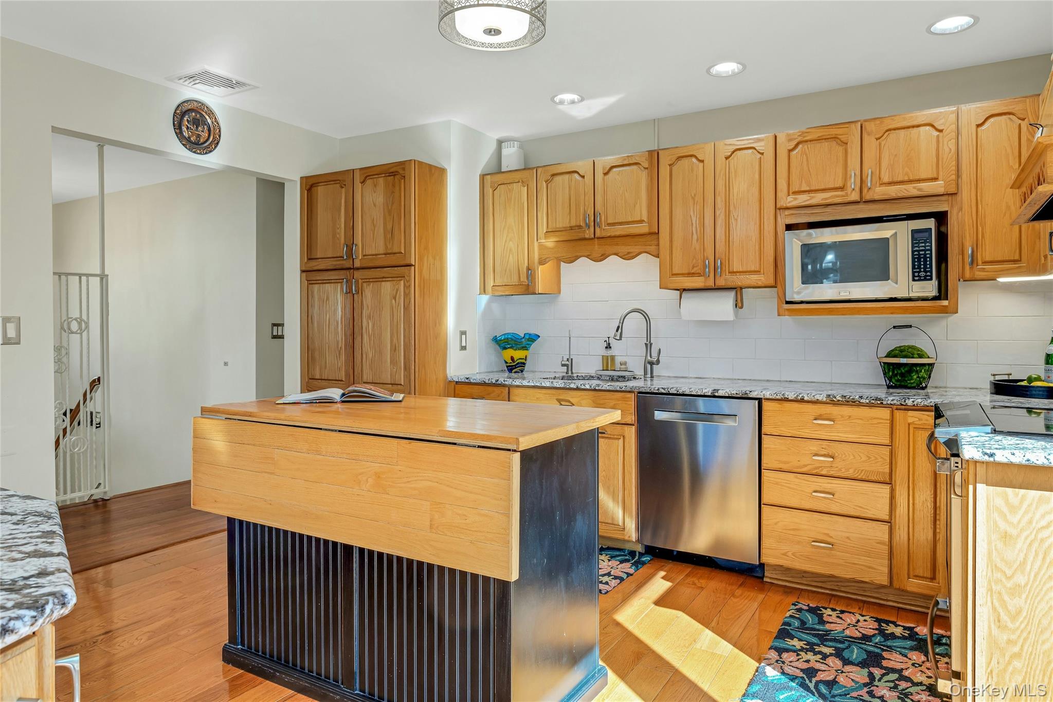 204 Cherry Hill Road Carmel, NY 10512 - Photo 10 of 36 a kitchen with stainless steel appliances granite countertop a sink stove and refrigerator