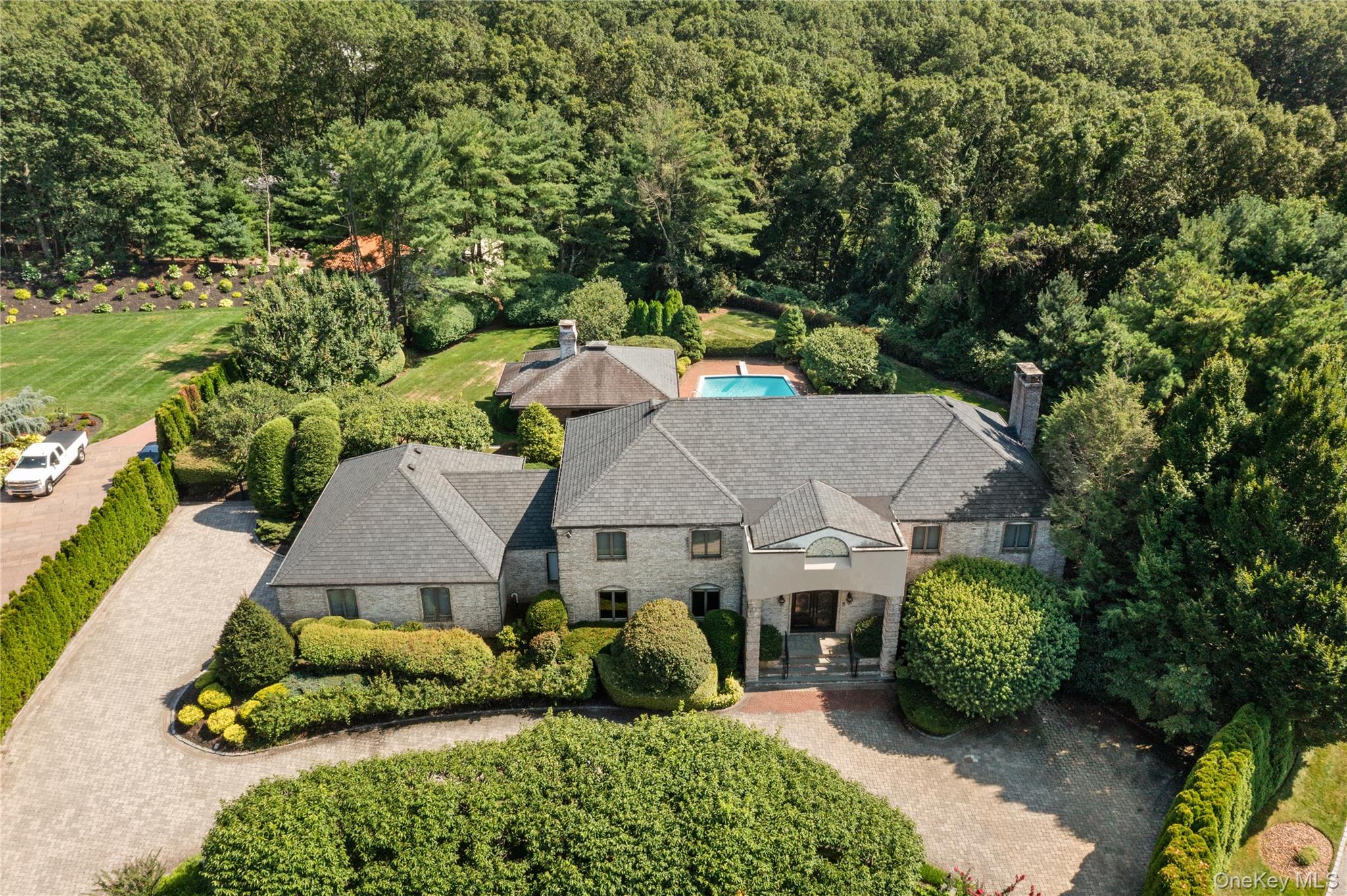 294 Half Hollow Road Dix Hills, NY 11746 - Photo 1 of 44 an aerial view of a house with a yard
