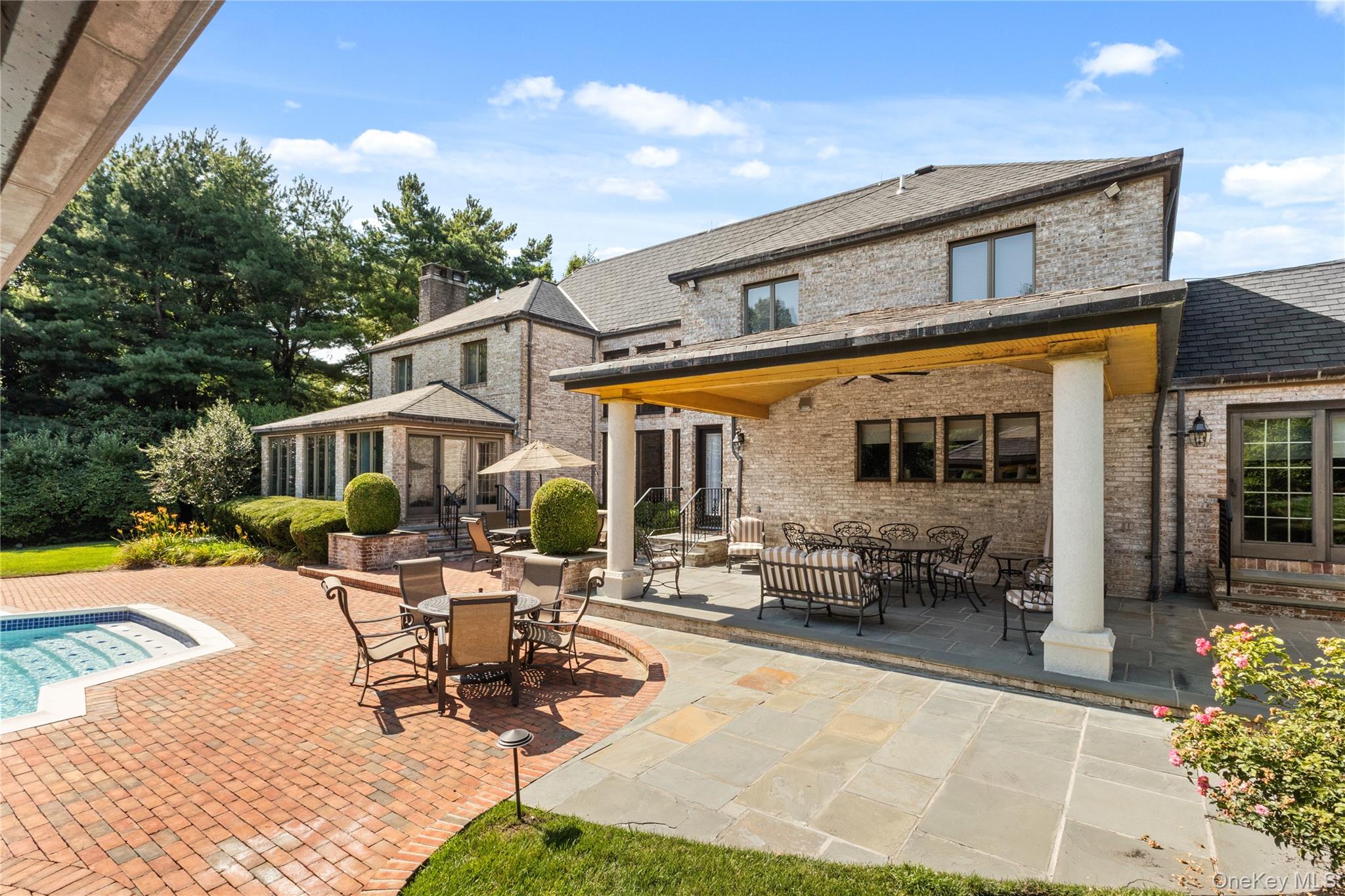 294 Half Hollow Road Dix Hills, NY 11746 - Photo 11 of 44 a building outdoor space with patio furniture and potted plants