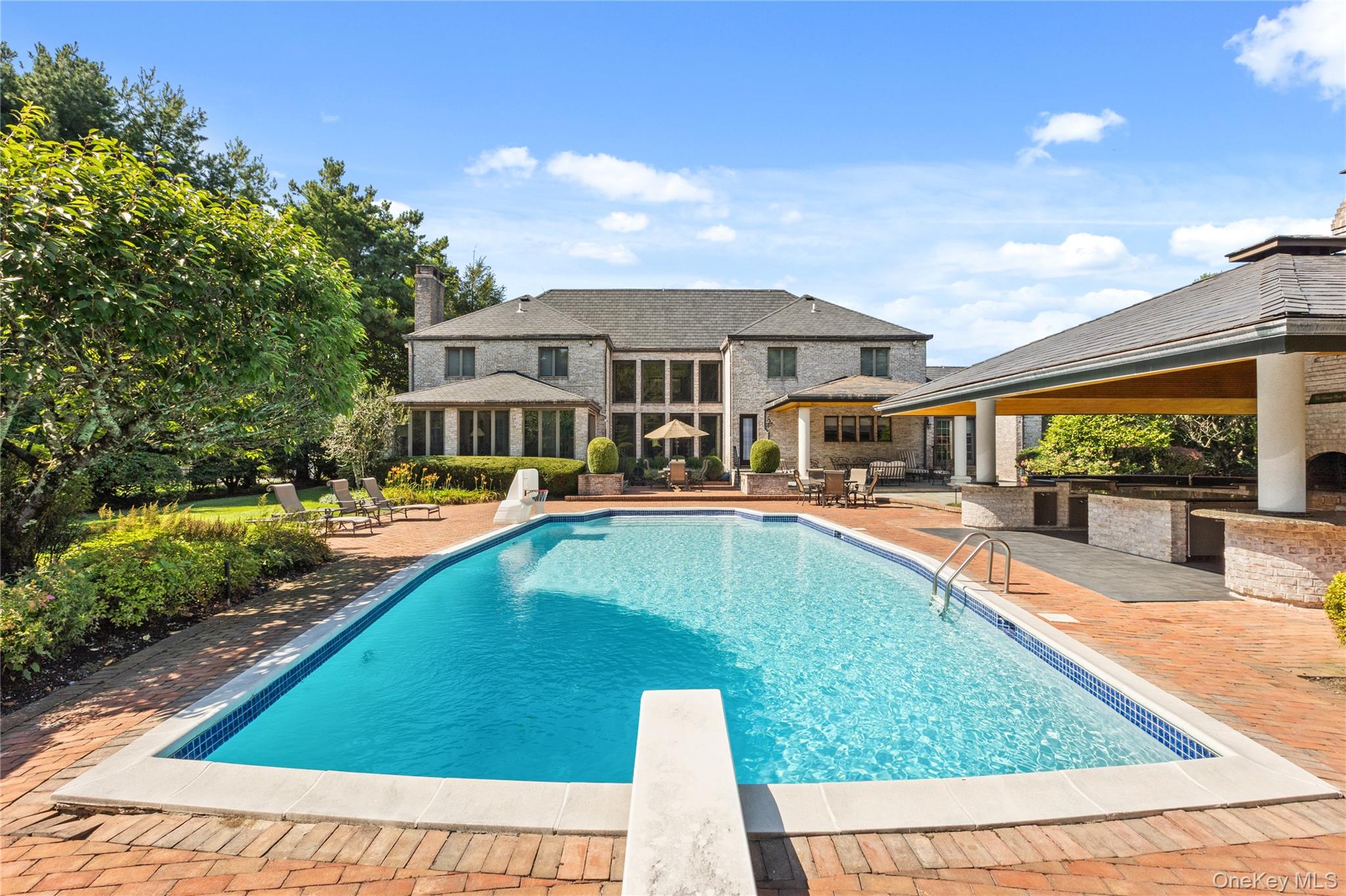 294 Half Hollow Road Dix Hills, NY 11746 - Photo 14 of 44 a swimming pool view with a outdoor seating