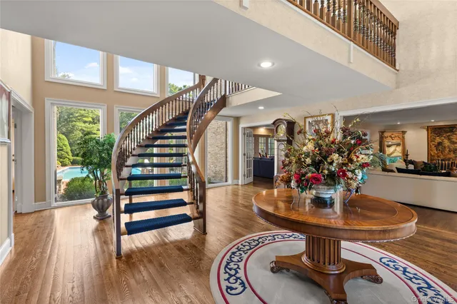 a dining room with furniture and wooden floor