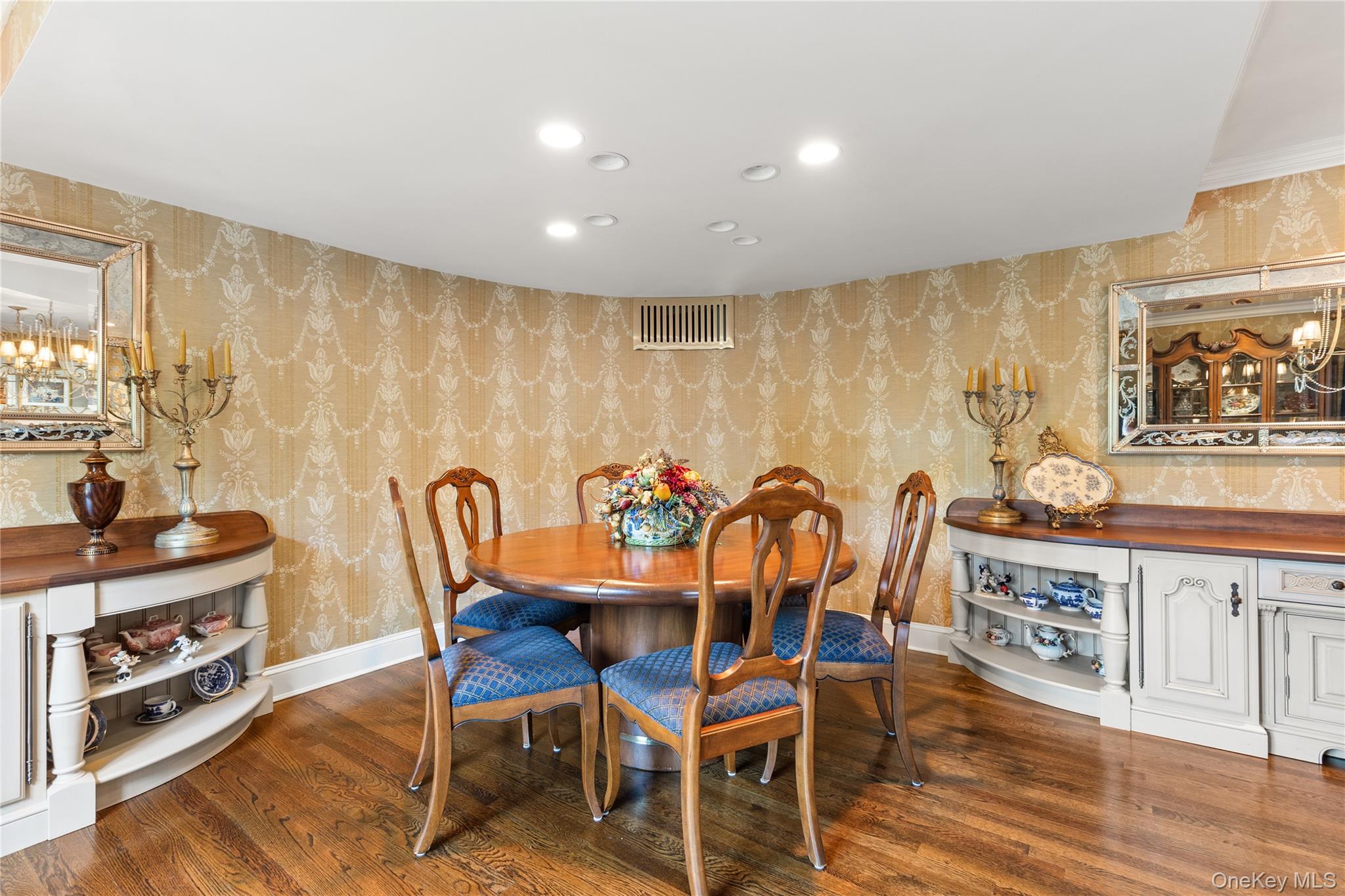 294 Half Hollow Road Dix Hills, NY 11746 - Photo 26 of 44 a view of a dining room with furniture a kitchen and chandelier