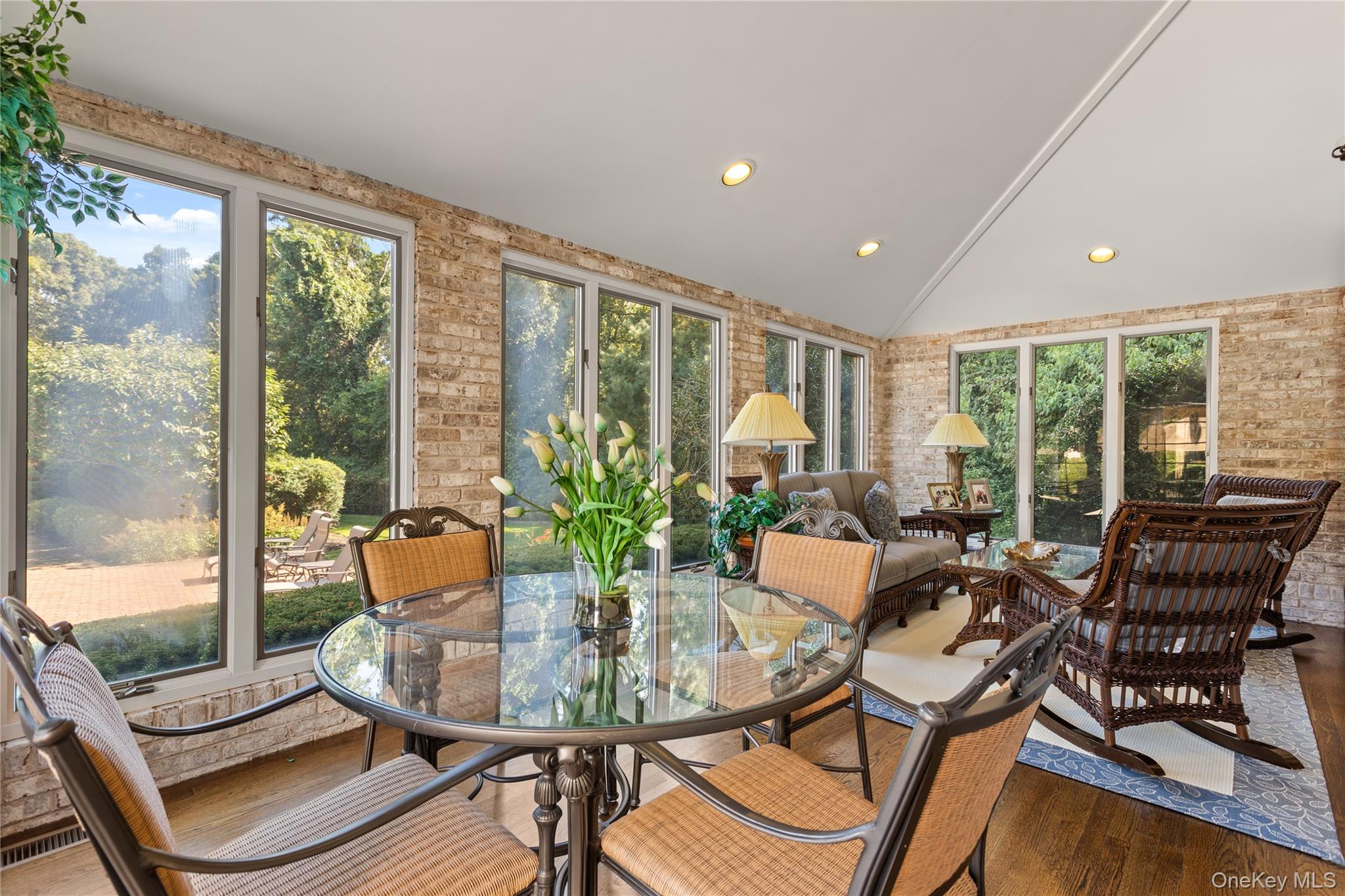 294 Half Hollow Road Dix Hills, NY 11746 - Photo 27 of 44 a dining room with furniture a chandelier and wooden floor