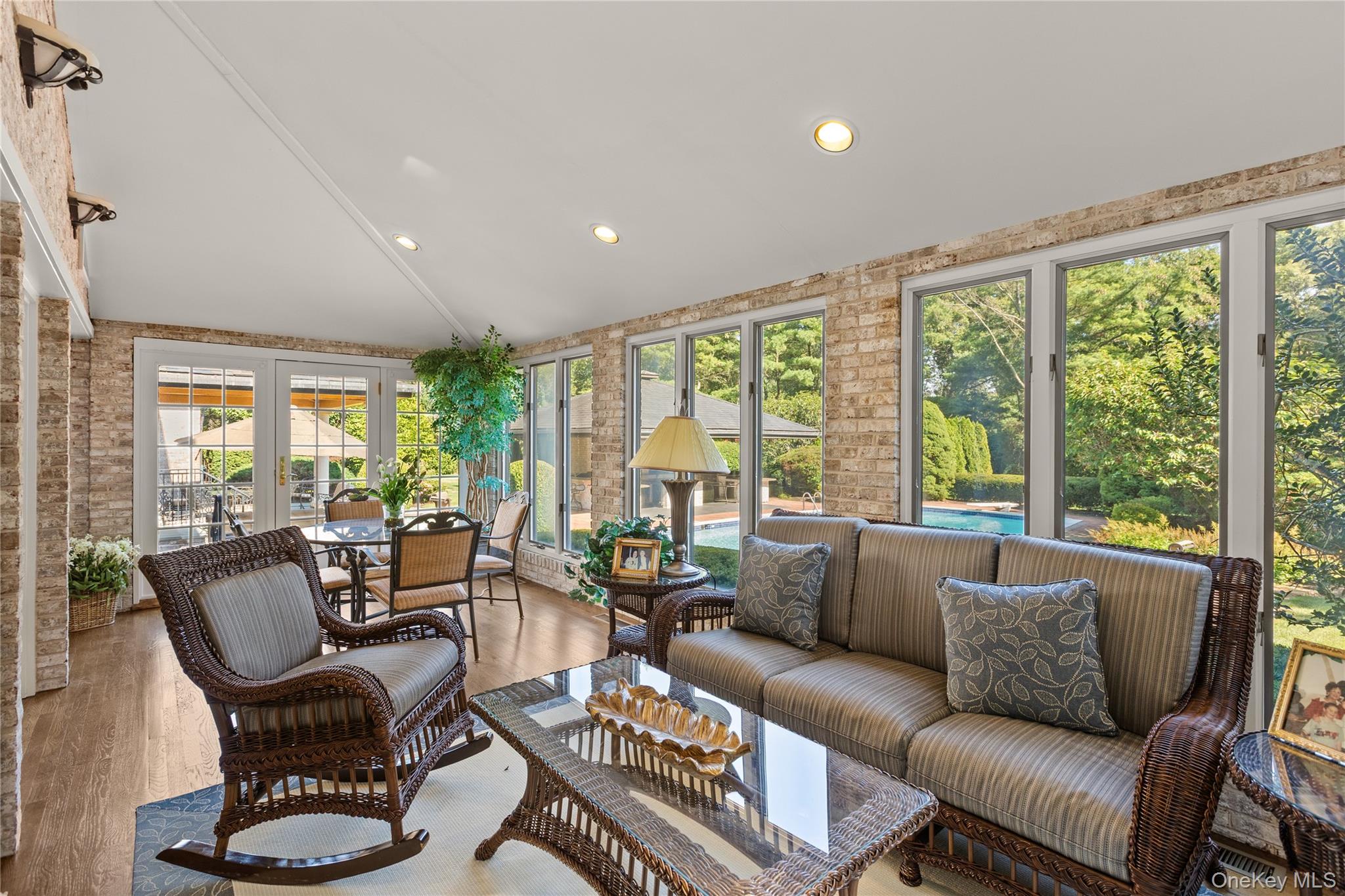 294 Half Hollow Road Dix Hills, NY 11746 - Photo 28 of 44 a living room with furniture and a large window