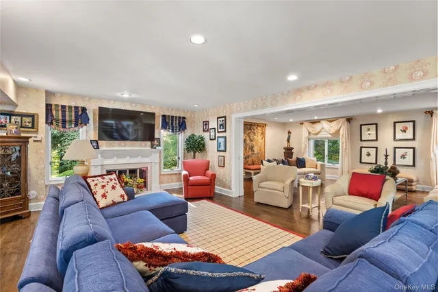 a living room with furniture fireplace and a flat screen tv