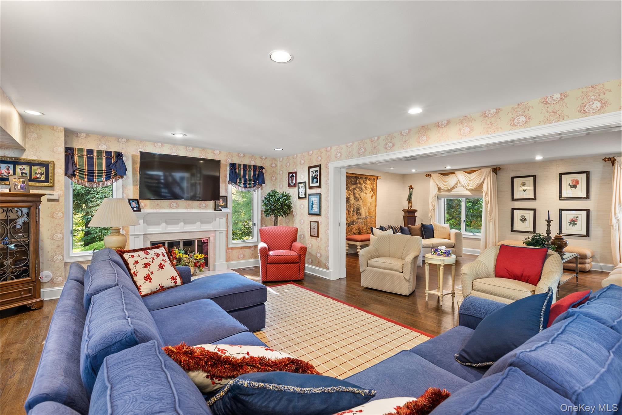 294 Half Hollow Road Dix Hills, NY 11746 - Photo 32 of 44 a living room with furniture fireplace and a flat screen tv