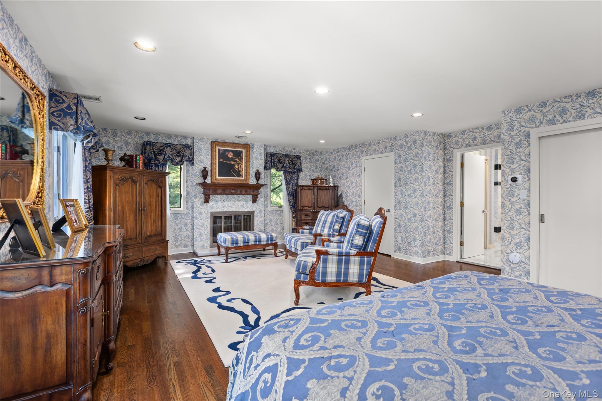 294 Half Hollow Road Dix Hills, NY 11746 - Photo 33 of 44 a living room with fireplace furniture and a flat screen tv
