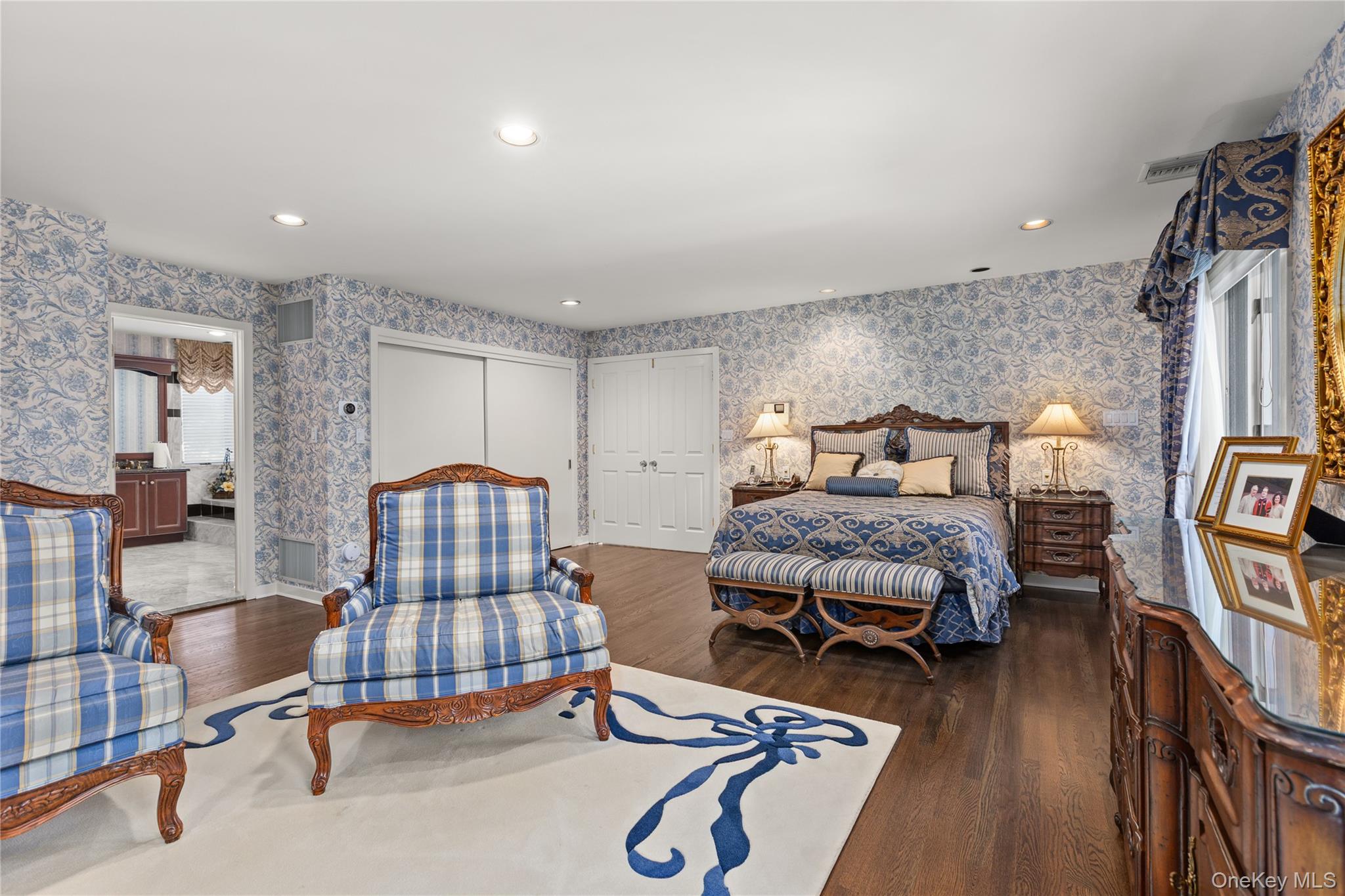 294 Half Hollow Road Dix Hills, NY 11746 - Photo 34 of 44 a bedroom with furniture and a wooden floor