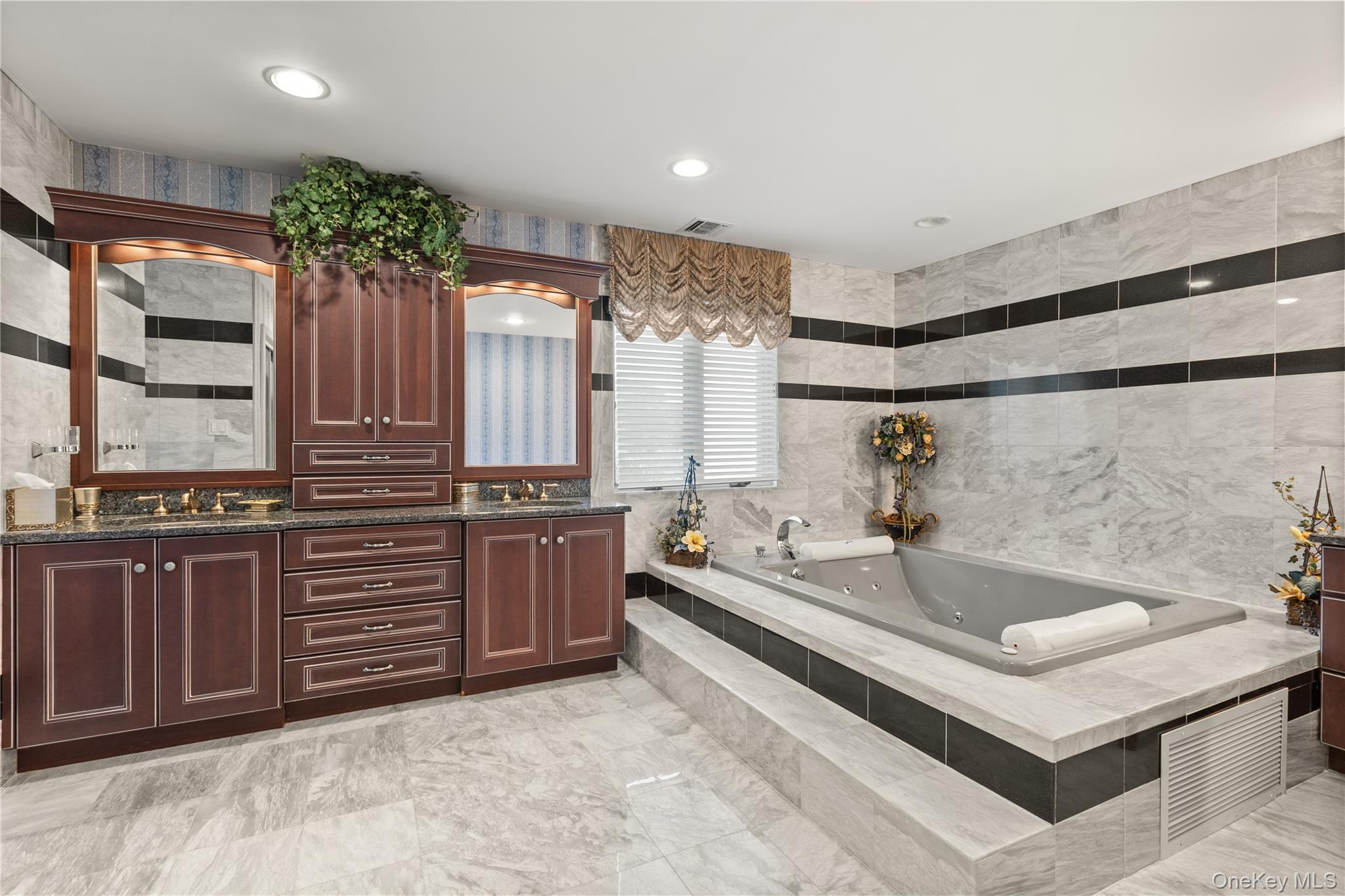 294 Half Hollow Road Dix Hills, NY 11746 - Photo 35 of 44 a spacious bathroom with a tub sink and mirror