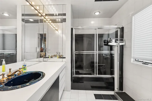 a kitchen with a sink and refrigerator