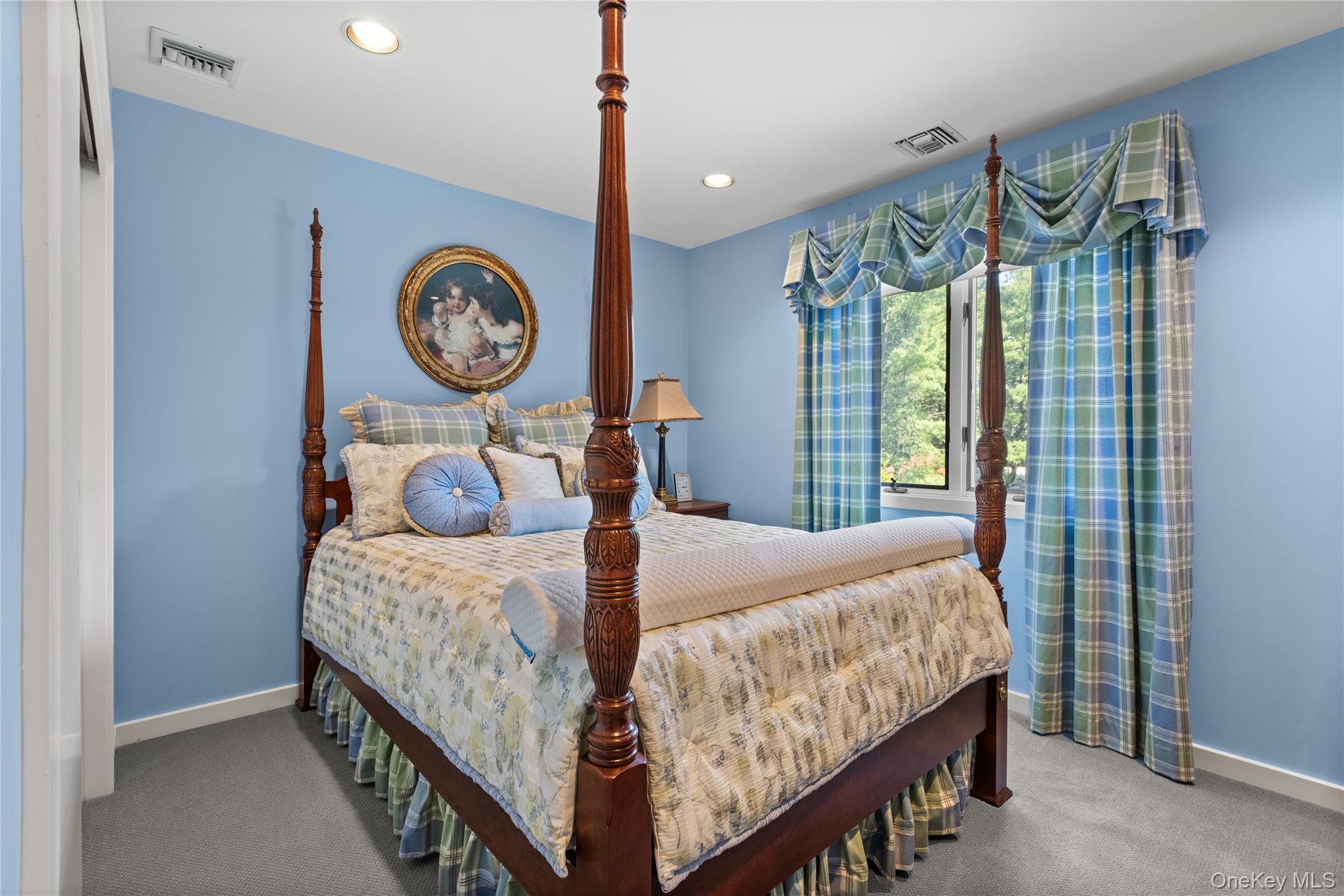 294 Half Hollow Road Dix Hills, NY 11746 - Photo 39 of 44 a bedroom with a bed and a large window