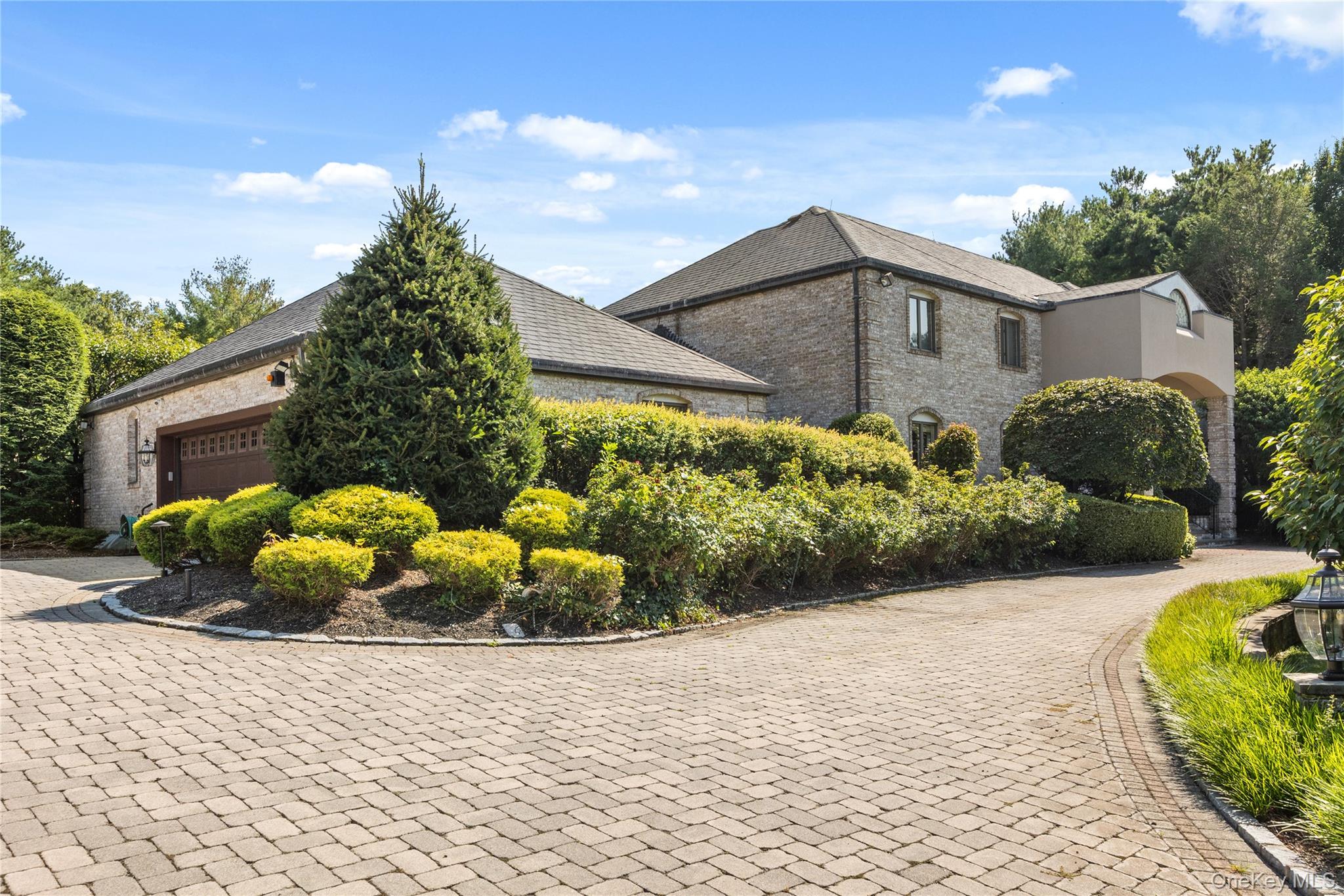 294 Half Hollow Road Dix Hills, NY 11746 - Photo 4 of 44 a front view of a house with a yard and potted plants