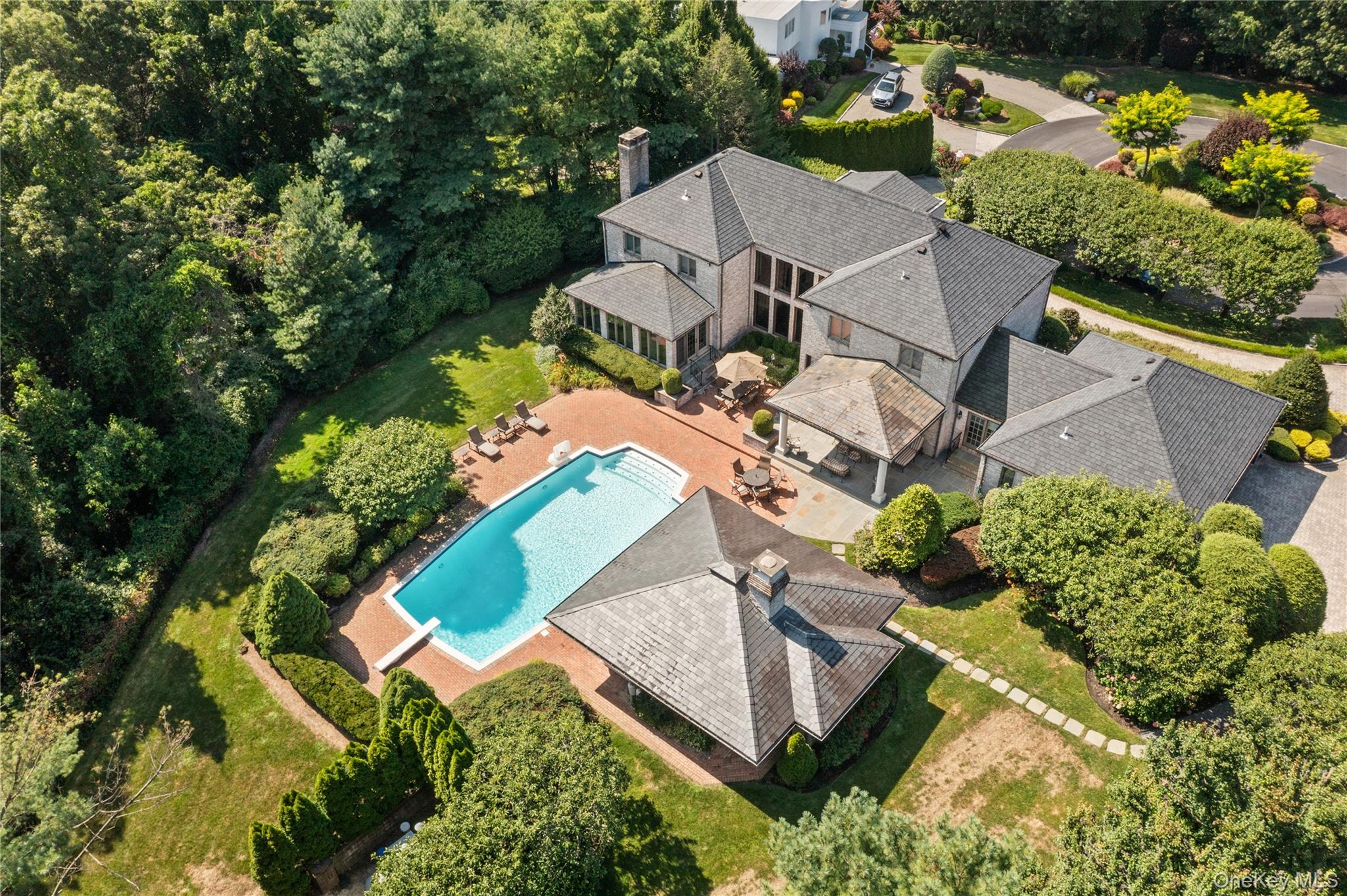 294 Half Hollow Road Dix Hills, NY 11746 - Photo 8 of 44 an aerial view of a house with a garden and swimming pool