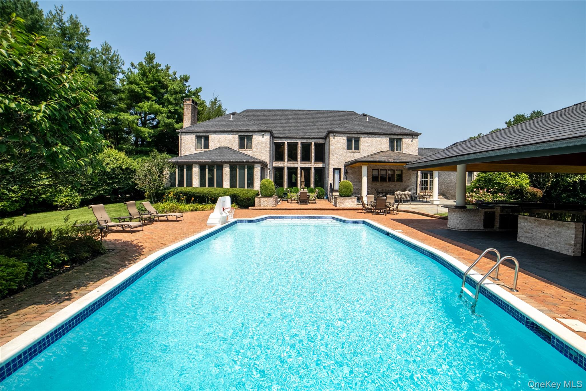 294 Half Hollow Road Dix Hills, NY 11746 - Photo 9 of 44 a swimming pool view with a outdoor seating