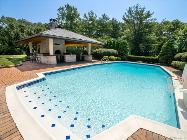 a view of a swimming pool with a patio