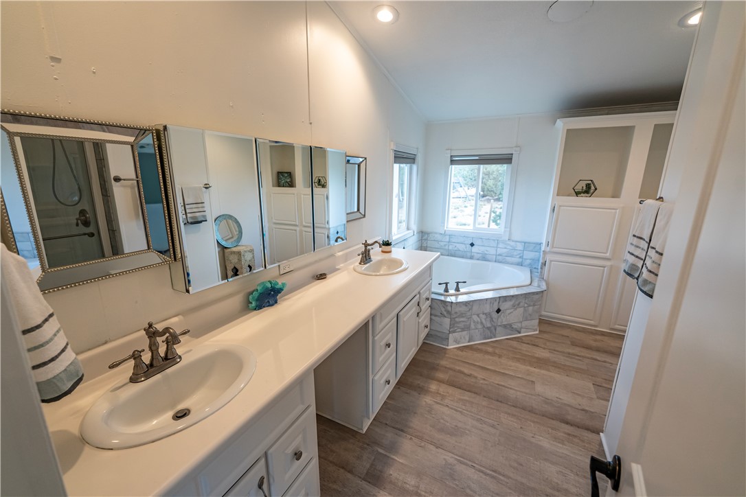 2765 North Silver Springs Road Kingman, AZ 86401 - Photo 33 of 60 a bathroom with a sink a mirror and a toilet