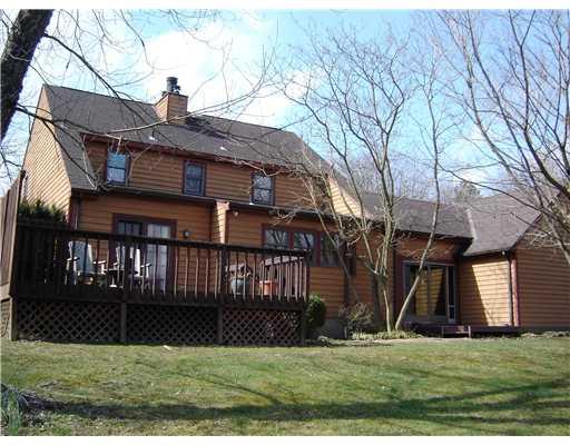 58 Shuster Road Gibsonia, PA 15044 - Photo 14 of 18 Exterior Back. The rear of the home offers a deck and garden area.