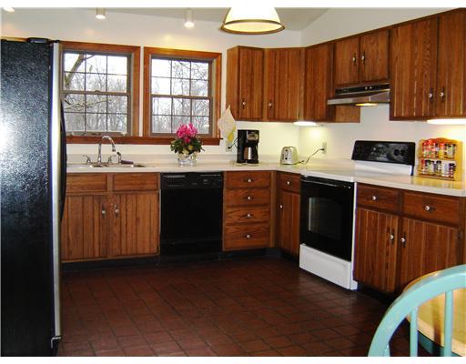 58 Shuster Road Gibsonia, PA 15044 - Photo 5 of 18 Kitchen. The eat-in sized country kitchen features ceramic tile floors, vaulted ceiling and a panoramic view of the rear yard.