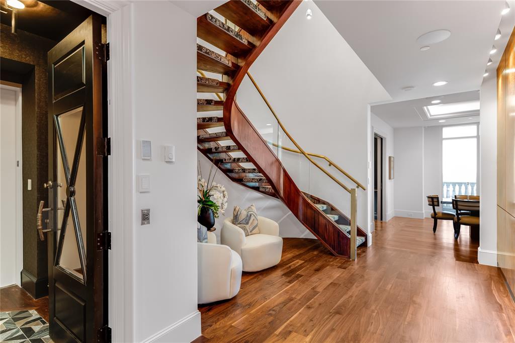 3505 Turtle Creek Boulevard, Unit 18C Dallas, TX 75219 - Photo 1 of 33 a view of entryway and hall with wooden floor