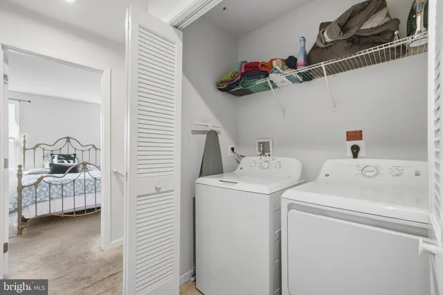 a view of storage and utility room with washer and dryer
