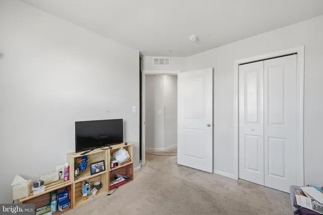 a view of a livingroom with furniture and a flat screen tv