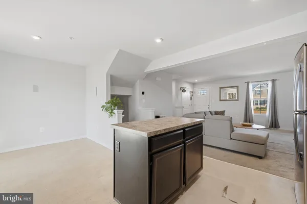 a living room with granite countertop furniture and fireplace