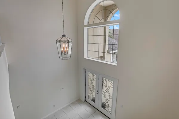 a kitchen with stainless steel appliances granite countertop a stove top oven a sink dishwasher a refrigerator and a oven with wooden cabinets