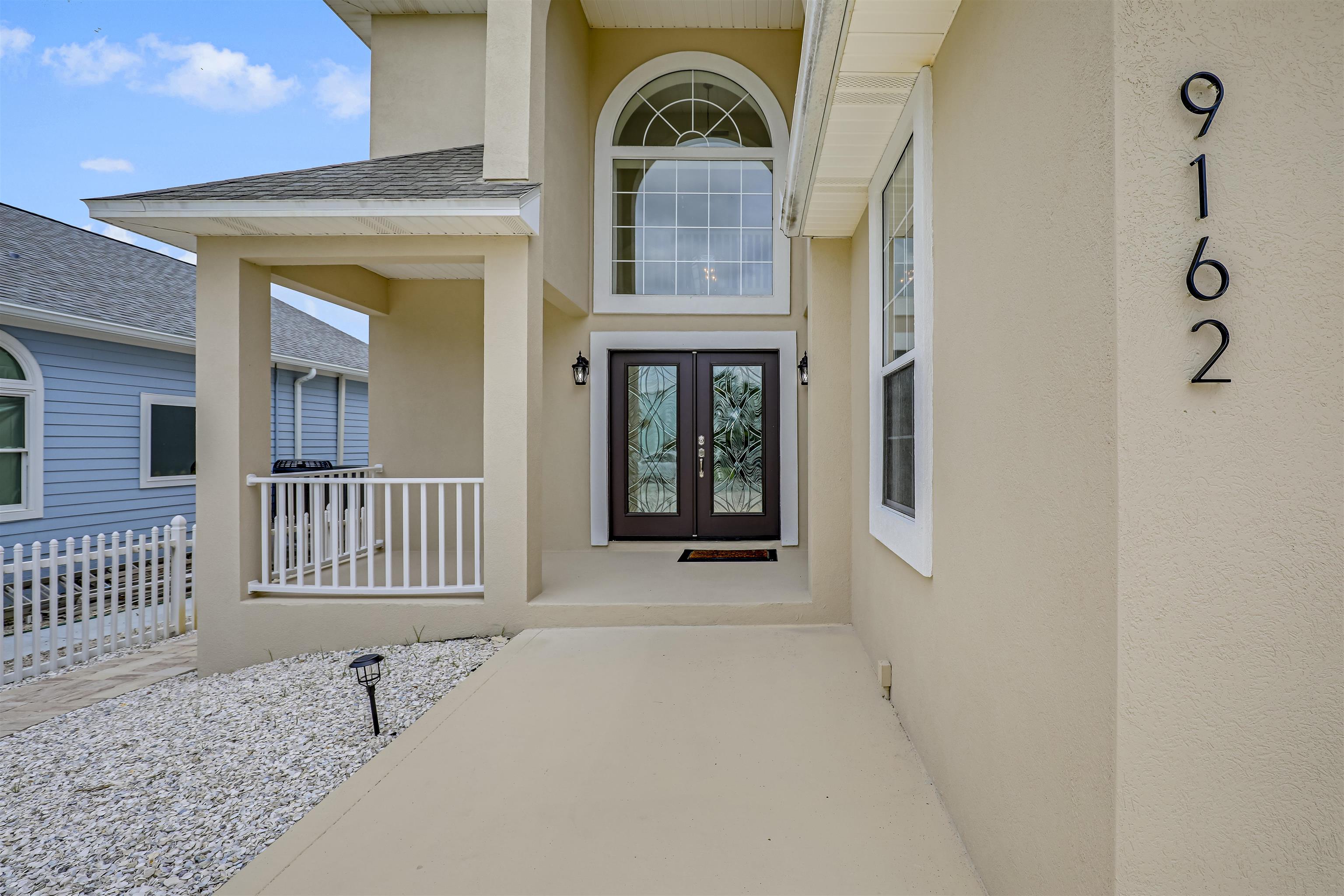 9162 August Circle St. Augustine, FL 32080 - Photo 15 of 81 a view of a door and a window