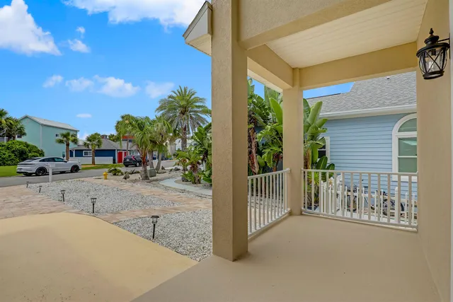 a view of an empty room with exposed radiator and fireplace
