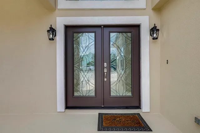 a large kitchen with a large counter top appliances and cabinets