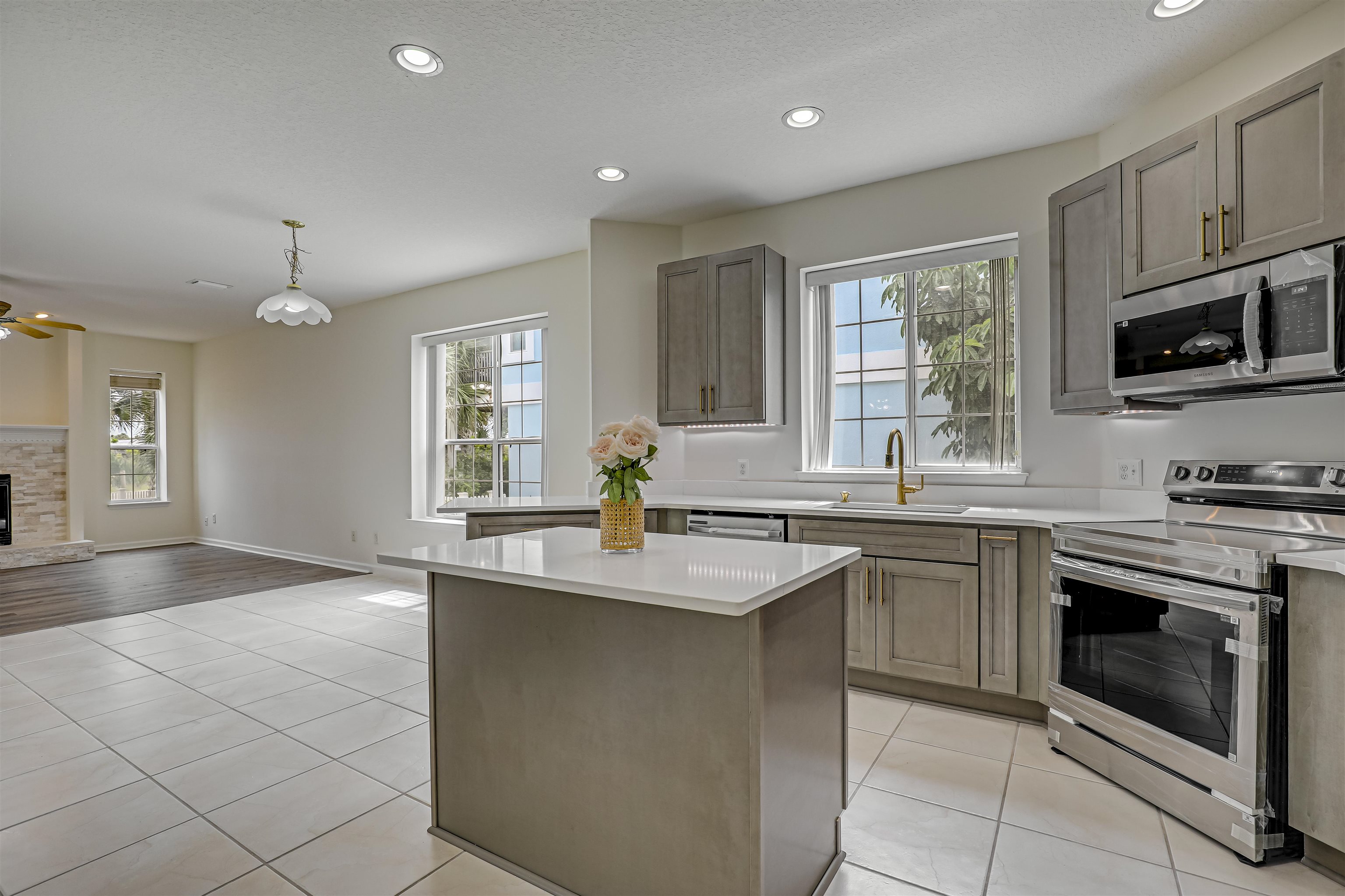 9162 August Circle St. Augustine, FL 32080 - Photo 2 of 81 a kitchen with stainless steel appliances granite countertop a sink stove and microwave