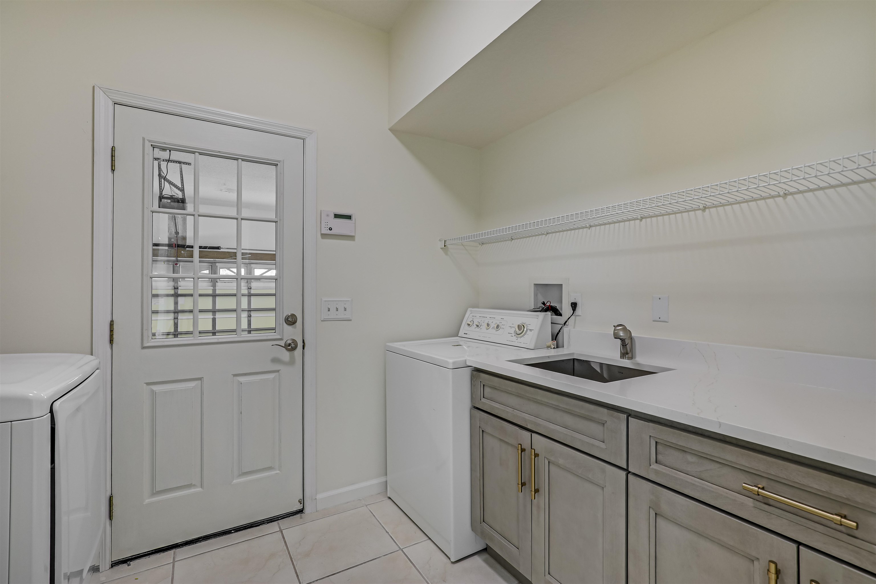9162 August Circle St. Augustine, FL 32080 - Photo 22 of 81 a kitchen with a sink and cabinets
